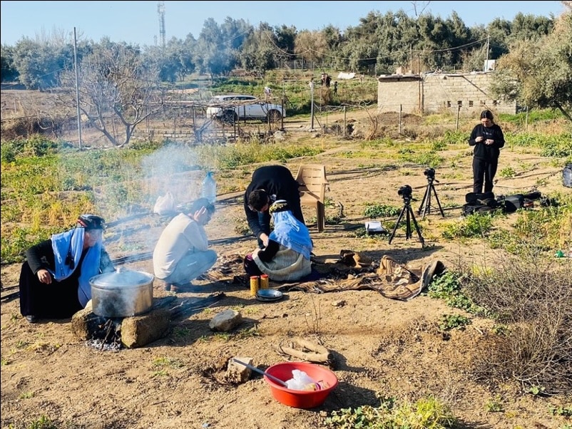 Documenting the preparation of smat, a traditional Yazidi lamb stew. Intangible cultural heritage video documentation. Photo courtesy of the Yazda Intangible Cultural Heritage Documentation team, Duhok, Kurdistan.