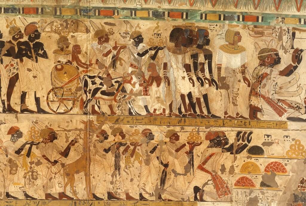 Rulers of Nubia accompanied by their entourage present gifts and pay homage to the Pharaoh. Tomb of Huy (TT40), ca. 1353–1527. Facsimile painting by Charles K. Wilkinson. Metropolitan Museum of Art 30.4.21. Public Domain.