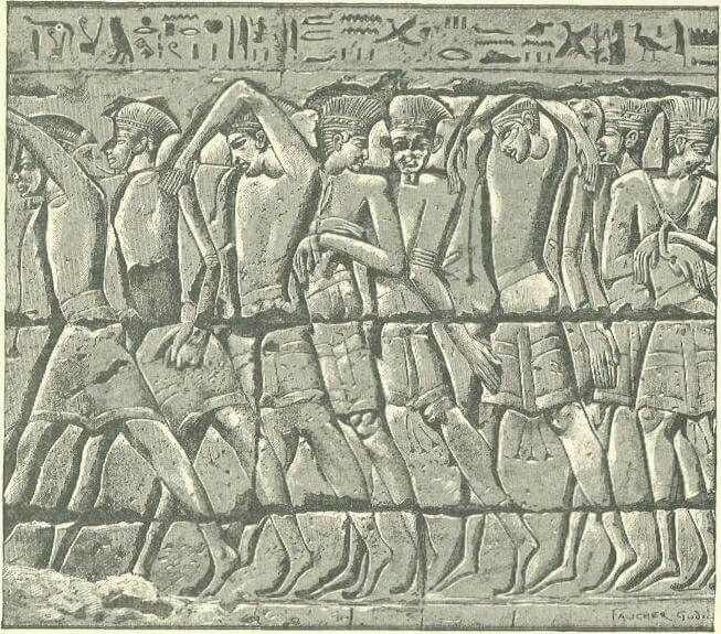 Figure 1. Procession of Philistine captives, relief at the Temple of Ramesses III at Medinet Habu. Drawing by Henri Faucher-Gudin, from History of Egypt, Chaldea, Syria, Babylonia, and Assyria, ed. by G. Maspero (1903–1904). Public Domain.