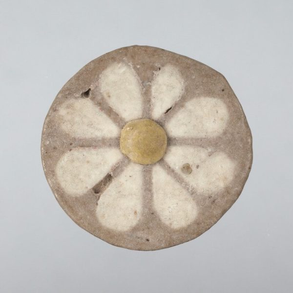 Figure 5. “Rosette plaque”, ca. 1175 BCE. We believe the rosette device so popular in the eastern Mediterranean in the late Bronze Age and Iron Age was inspired by the crown daisy.