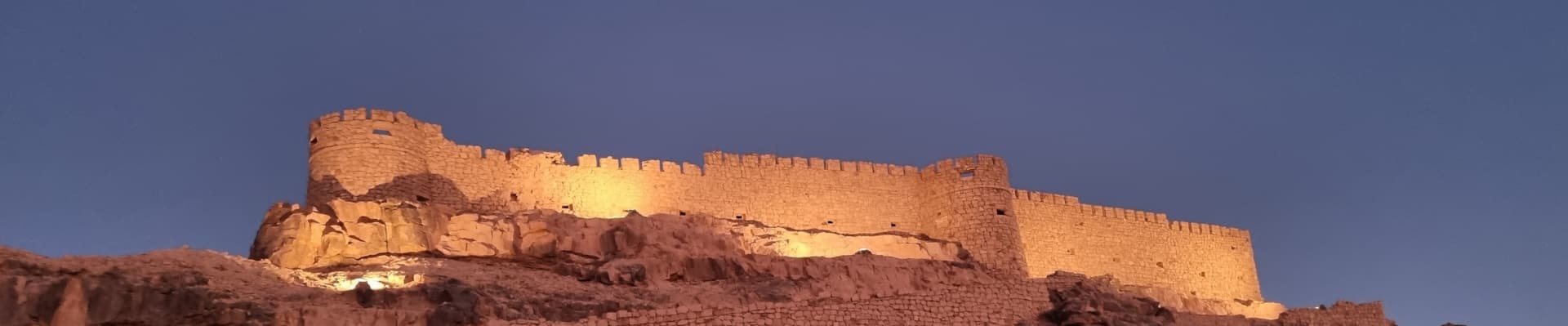 A photo of Ghat Fort in Libya, taken at night.