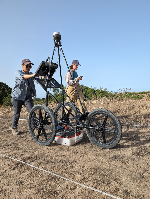 Team members conducting ground-penetrating radar survey