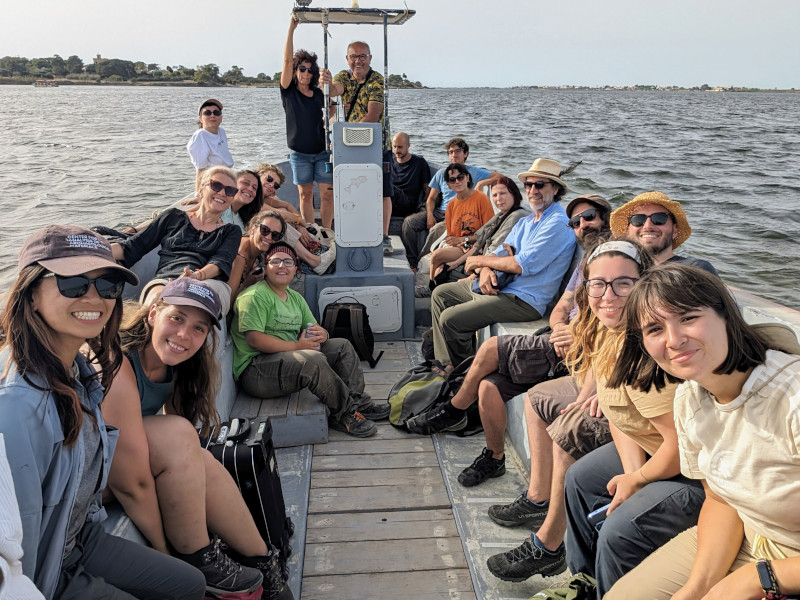 Students and team members on the boat to site.